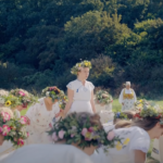 woman in white dress standing in a field